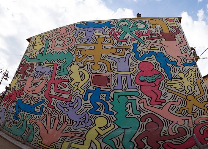 Tuttomondo Mural Tuttomondo: the mural by Keith Haring in Pisa | Visit Tuscany photo